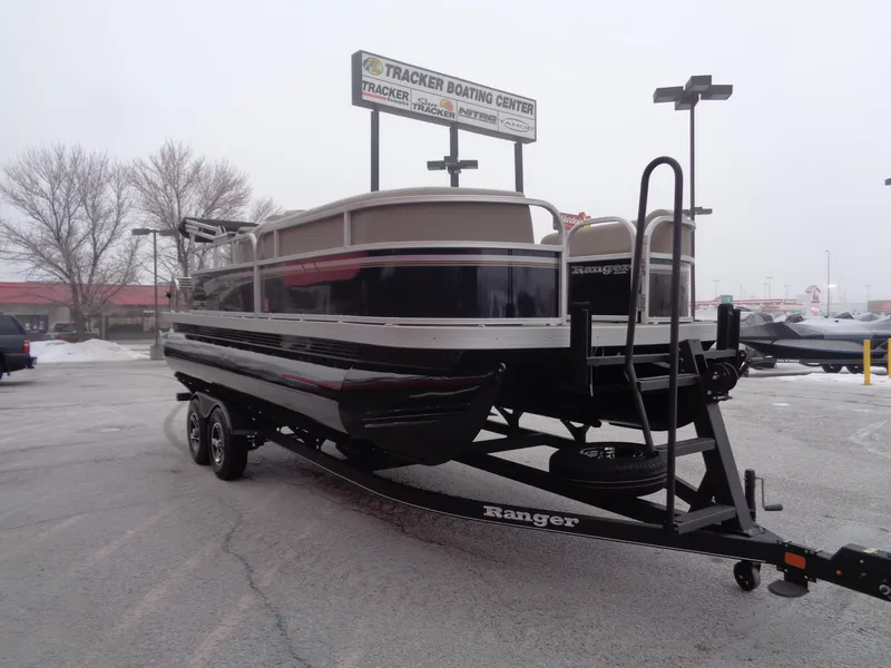 Slide: The Image of 2023 Ranger Reata 200C pontoon boat on trailer at Tracker Boating Center. - 42