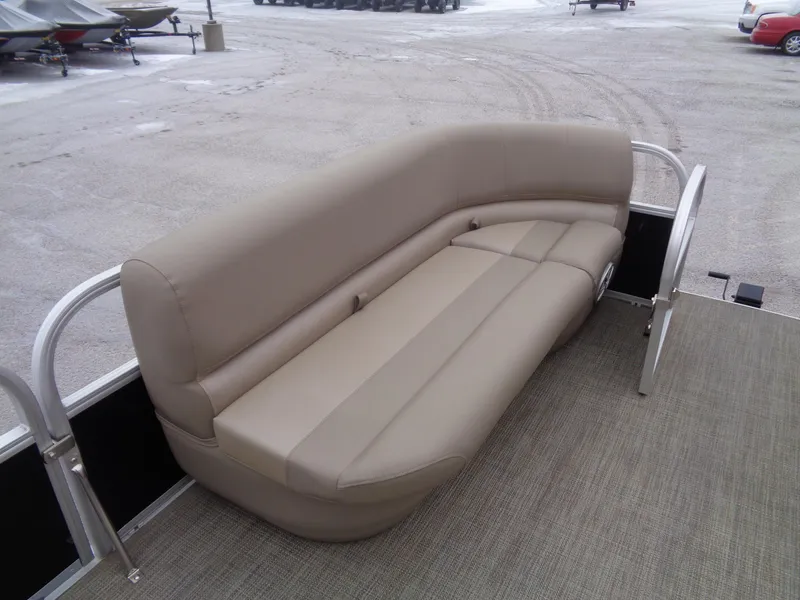 Slide: The Image of 2023 Ranger Reata 200C boat seating, beige upholstery, outdoor setting. - 44