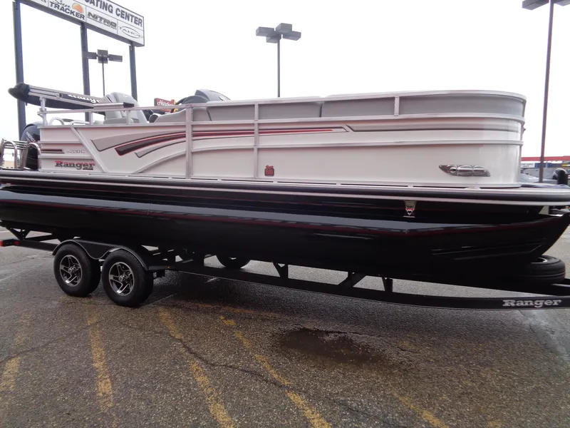Slide: The Image of 2023 Ranger Reata 220C pontoon boat on trailer, side view. - 4