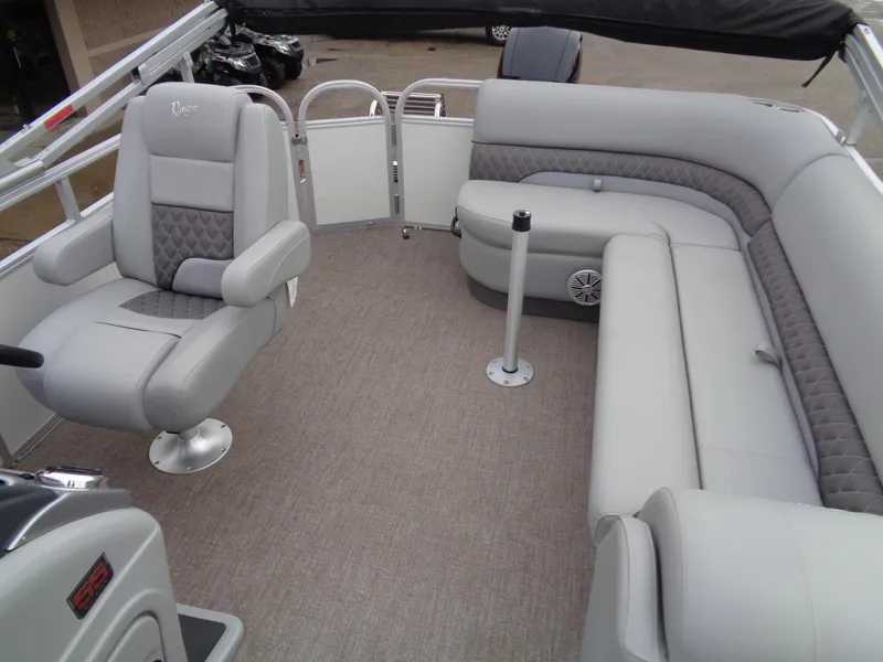 Slide: The Image of 2023 Ranger Reata 220C pontoon boat interior with gray seating and carpeted floor. - 7