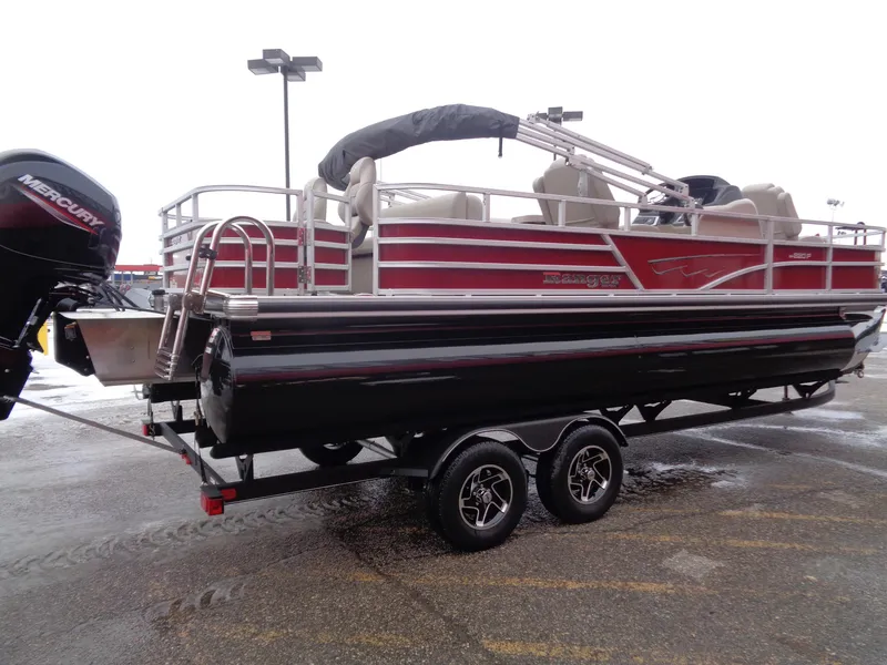 Slide: The Image of 2024 Ranger Reata 220F pontoon boat on trailer, featuring a Mercury outboard motor. - 5