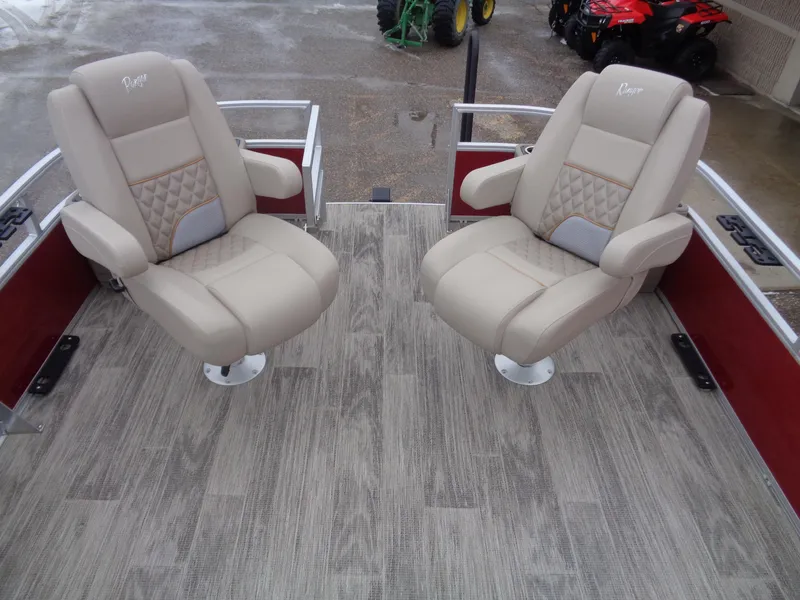 Slide: The Image of 2024 Ranger Reata 220F boat seats on wood-patterned deck. - 7