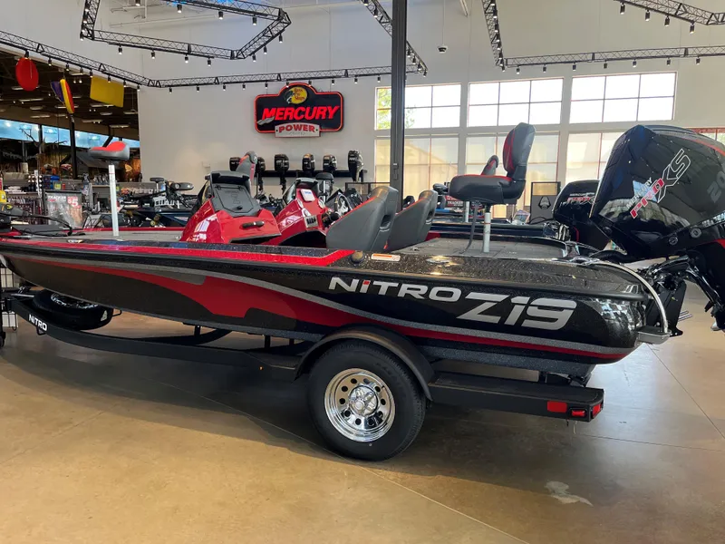 Slide: The Image of 2025 Nitro Z19 boat in showroom, featuring sleek design and Mercury engine. - 0