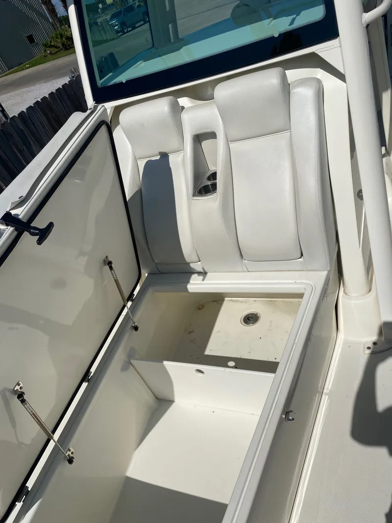 Slide: The Image of 2017 Hydra-Sports 3400 Center Console boat interior with open storage compartment. - 11