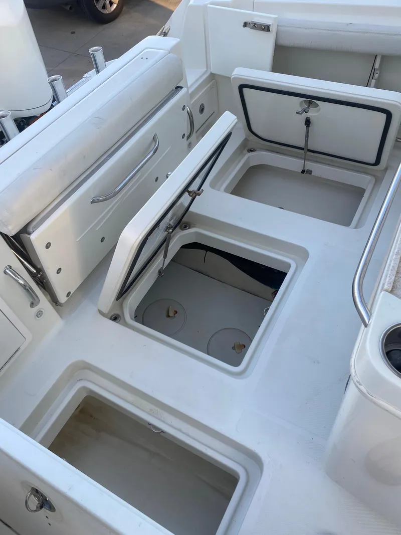 Slide: The Image of 2017 Hydra-Sports 3400 Center Console boat with open storage compartments. - 13