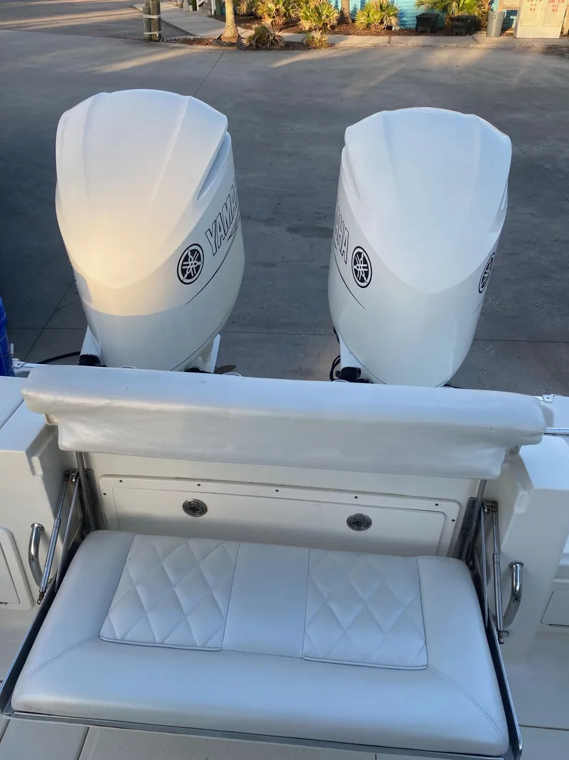 Slide: The Image of 2017 Hydra-Sports 3400 Center Console with dual Yamaha outboard engines and cushioned seating. - 14