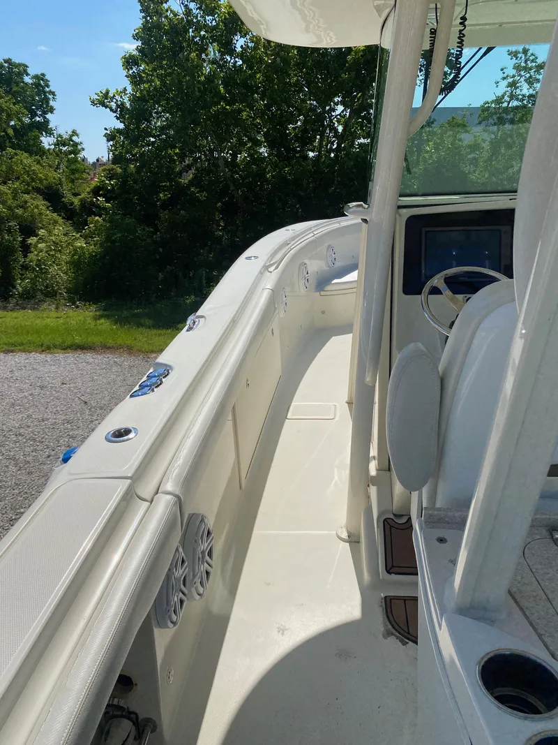 Slide: The Image of 2017 Hydra-Sports 3400 Center Console boat, side view, white interior, outdoor setting. - 6
