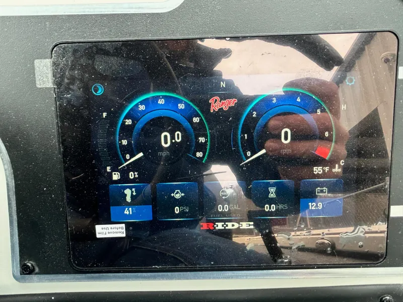 Slide: The Image of Dashboard display of 2025 Ranger ALPHA 208 showing speed, fuel, and temperature gauges. - 12