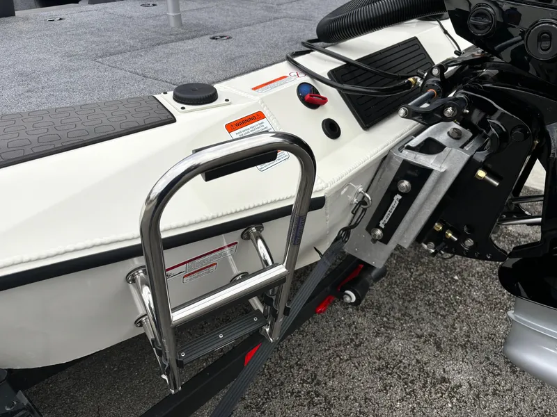 Slide: The Image of Ranger ALPHA 208 boat, 2025 model, featuring a rear ladder and motor mount. - 16