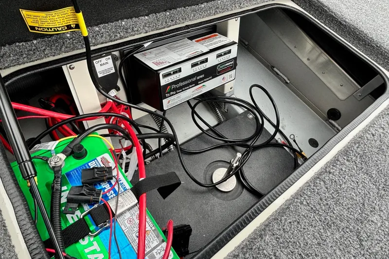 Slide: The Image of Ranger ALPHA 208 2025 battery compartment with wiring and charger setup. - 17