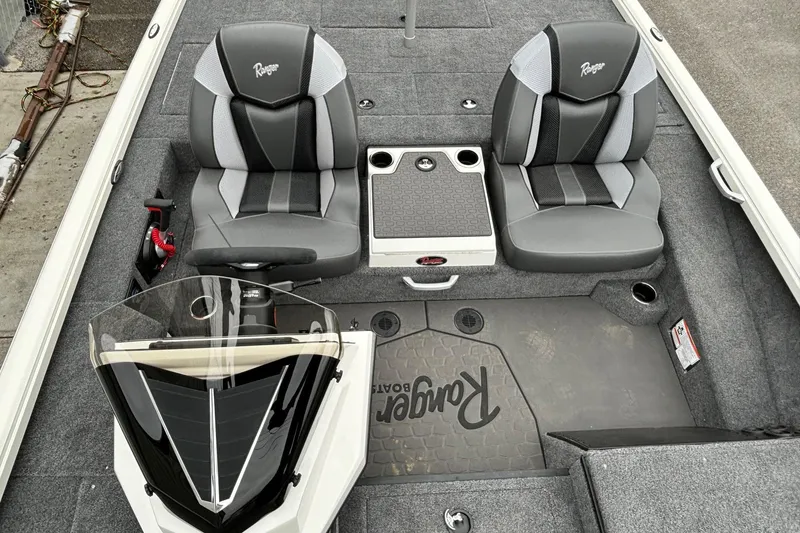 Slide: The Image of 2025 Ranger ALPHA 208 boat interior with dual seats and console. - 9