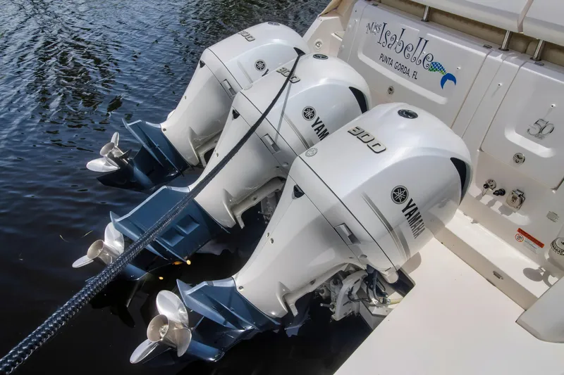 Slide: The Image of Triple Yamaha outboard engines on a 2020 Regal 38 XO boat. - 10