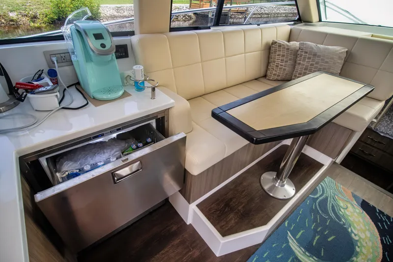 Slide: The Image of Luxurious interior of 2020 Regal 38 XO yacht with seating and kitchenette. - 23