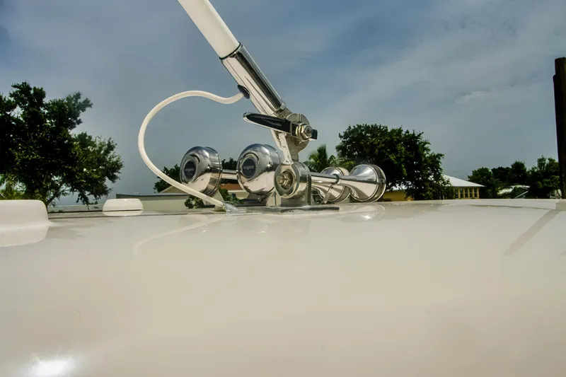 Slide: The Image of 2020 Regal 38 XO yacht deck with chrome fittings and clear sky. - 28