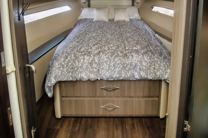 Slide: The Image of Cozy bedroom in 2020 Regal 38 XO yacht with modern bedding and wood accents. - 29