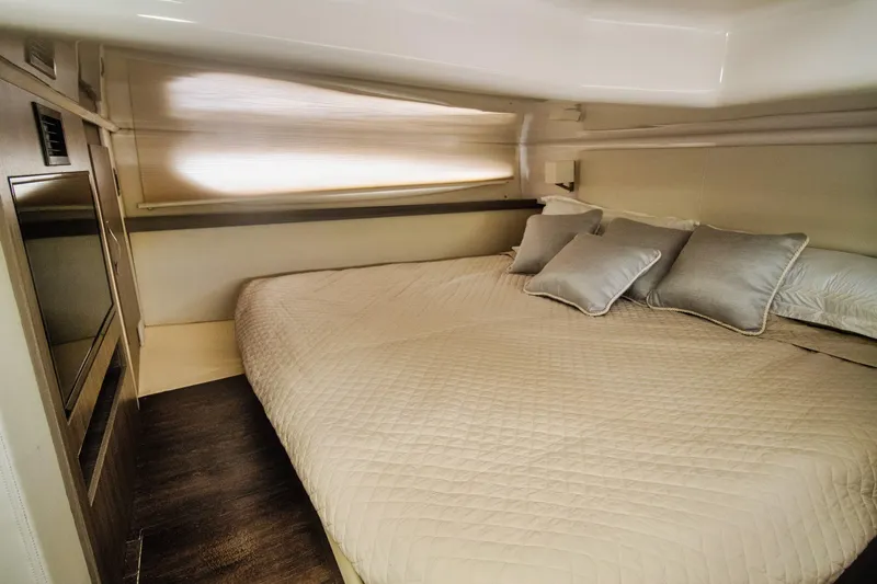Slide: The Image of Luxurious cabin interior of 2020 Regal 38 XO yacht with cozy bedding. - 34
