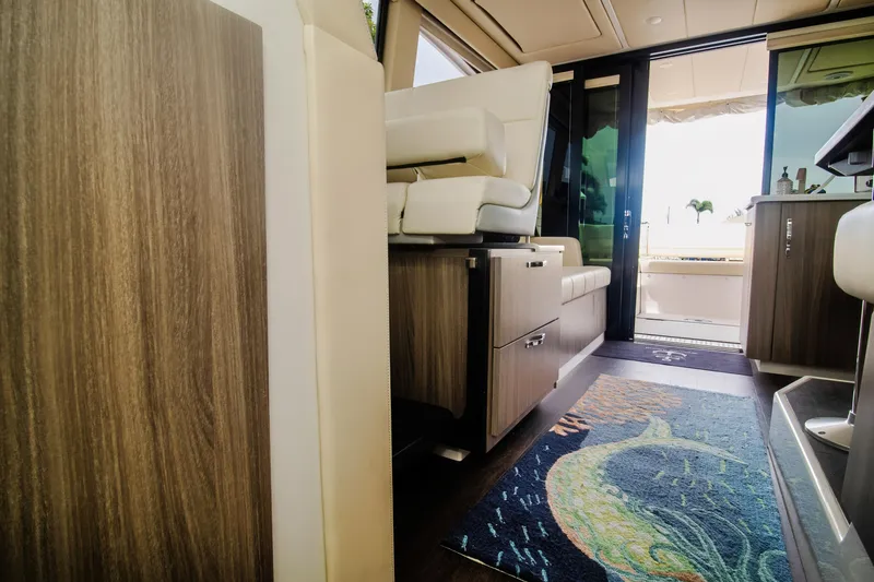Slide: The Image of Interior of 2020 Regal 38 XO yacht with modern furnishings and decorative rug. - 35