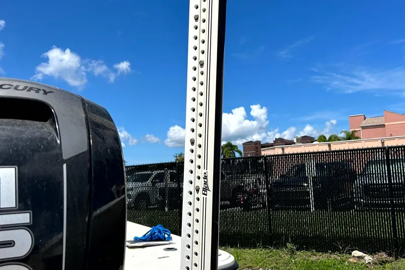 Slide: The Image of 2018 Mako 21LTS boat with Mercury engine, outdoor setting, blue sky background. - 19