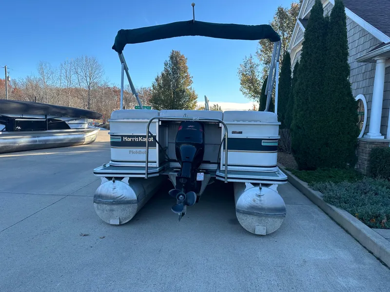 Slide: The Image of 2000 Harris EURO CLASSIC pontoon boat parked on driveway near house. - 16