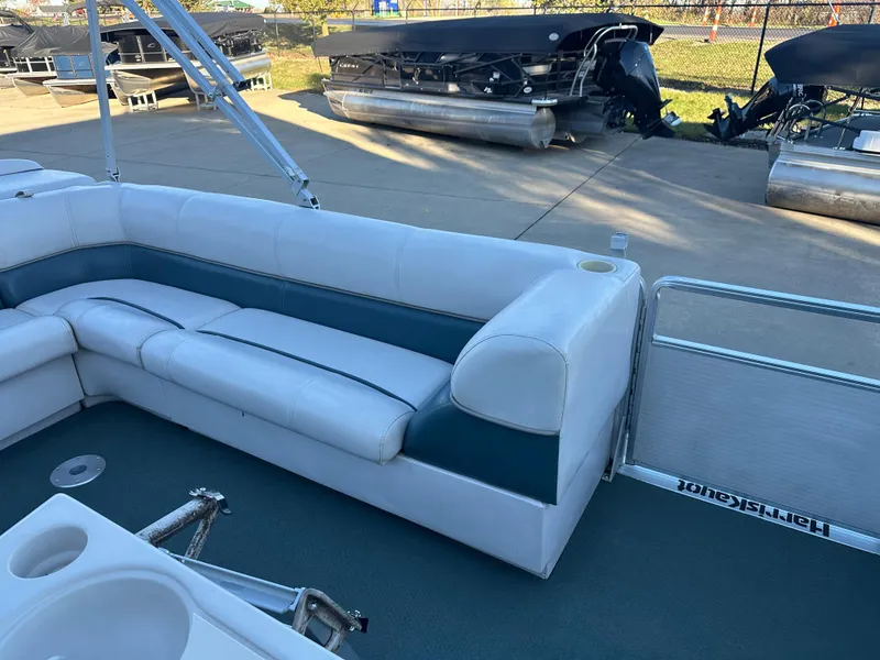 Slide: The Image of 2000 Harris EURO CLASSIC pontoon boat with white seating and cup holders. - 9