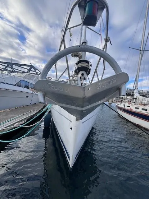 Slide: The Image of Front view of a 2001 Hunter 401 sailboat docked at a marina. - 10