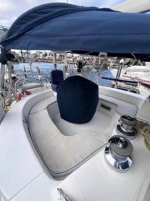 Slide: The Image of 2001 Hunter 401 sailboat cockpit with blue canopy and winches. - 14