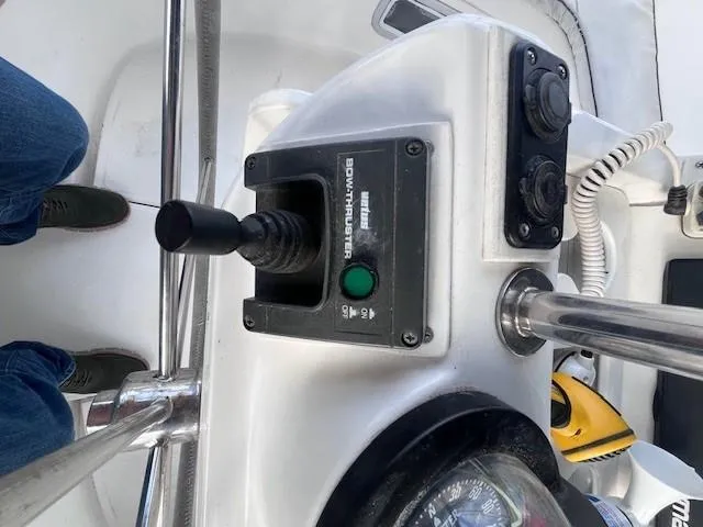 Slide: The Image of Boat control panel of a 2001 Hunter 401 with bow thruster joystick. - 18