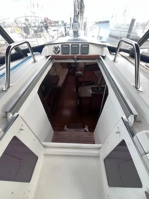 Slide: The Image of Interior view of 2001 Hunter 401 sailboat, showcasing cabin and seating area. - 19