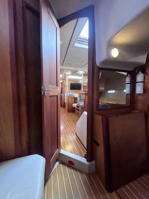 Slide: The Image of Interior of 2001 Hunter 401 sailboat with wooden finishes and modern amenities. - 43