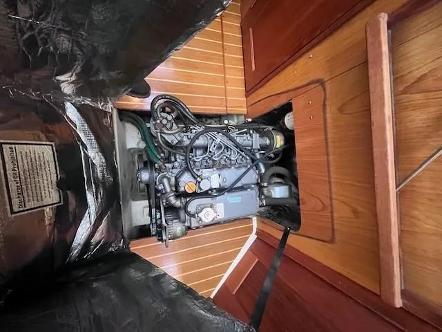 Slide: The Image of Engine compartment of a 2001 Hunter 401 sailboat with wooden flooring. - 45