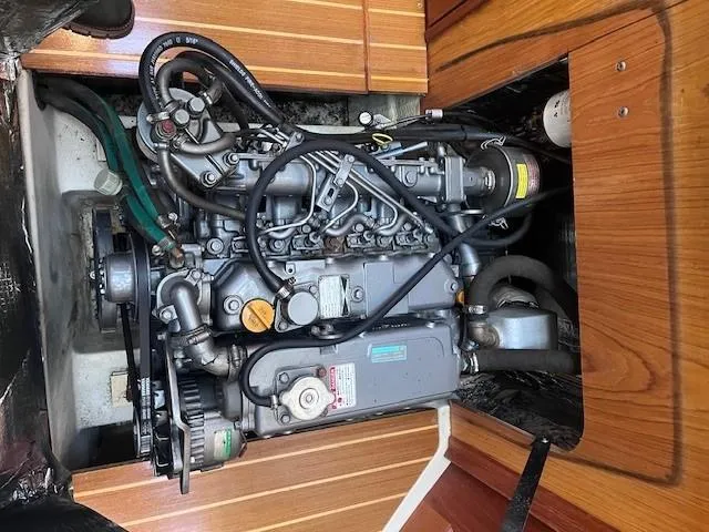 Slide: The Image of Engine of a 2001 Hunter 401 boat, showcasing intricate mechanical components. - 46