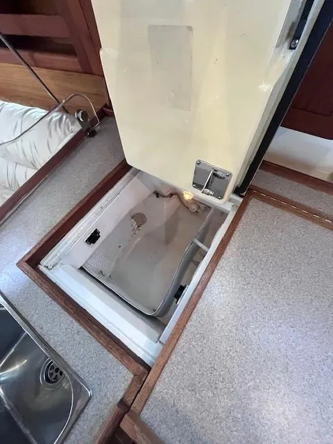 Slide: The Image of Open storage compartment in 2001 Hunter 401 boat interior. - 50