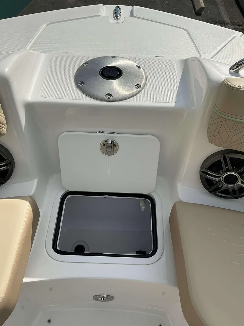 Slide: The Image of 2025 Hurricane 2400 SD boat interior with storage compartment and seating. - 17