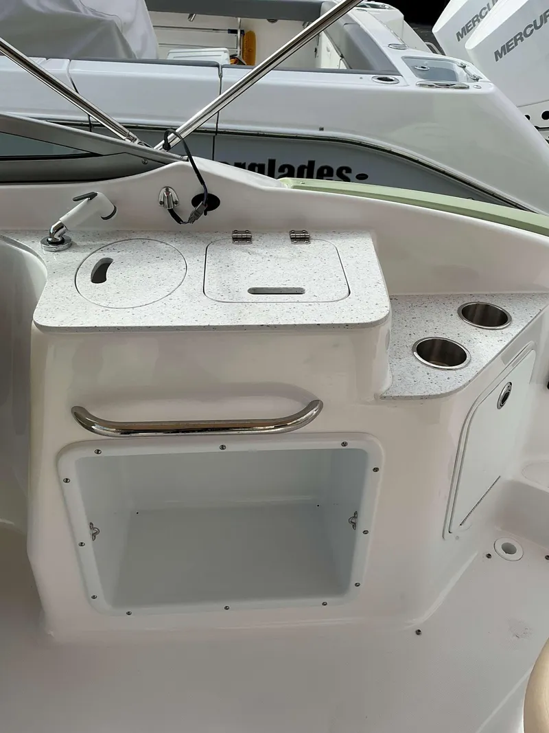 Slide: The Image of 2025 Hurricane 2400 SD boat interior with sink and storage area. - 6