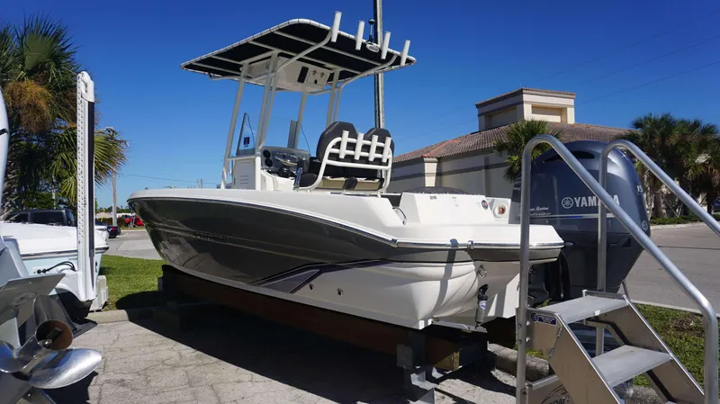 Slide: The Image of 2019 Stingray 216 CC boat with Yamaha engine on display outdoors. - 4