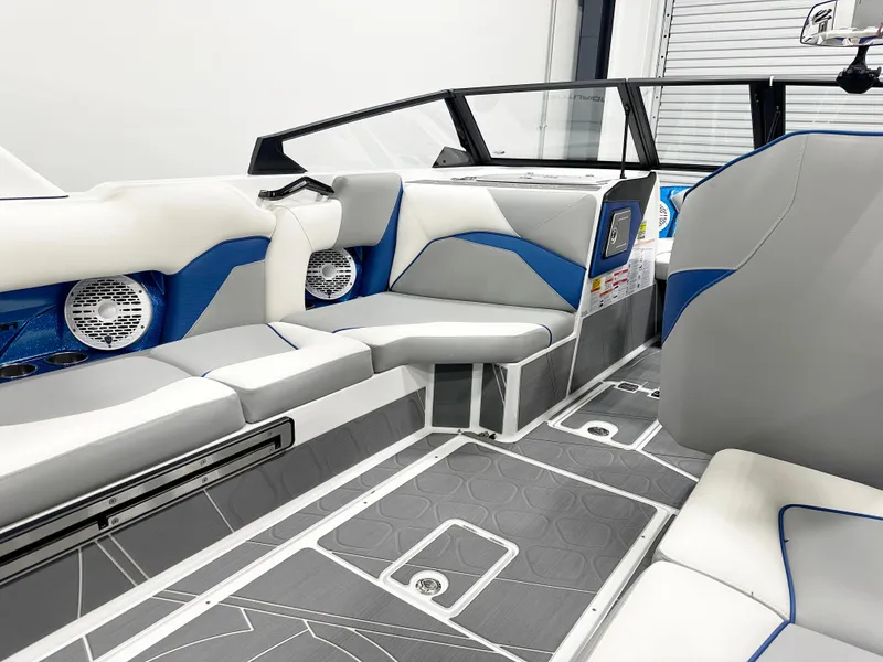 Slide: The Image of 2025 Centurion Fe23 boat interior with modern seating and sleek design. - 10