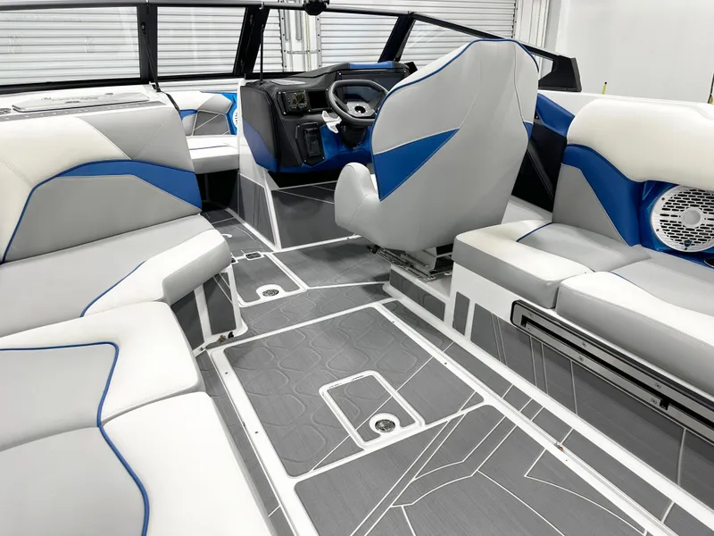 Slide: The Image of Interior of 2025 Centurion Fe23 boat with modern seating and sleek design. - 9