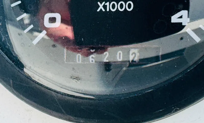 Slide: The Image of Close-up of a Catalina 320 tachometer showing 620.2 hours. - 28
