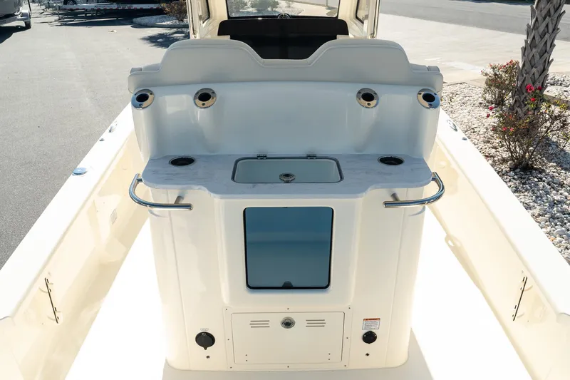 Slide: The Image of 2025 Scout 261 XSS boat interior with fishing rod holders and storage. - 13
