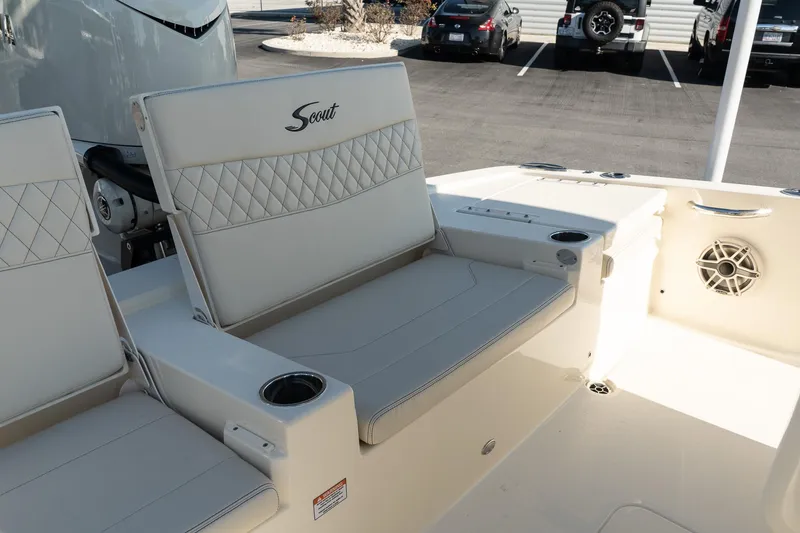 Slide: The Image of 2025 Scout 261 XSS boat interior with cushioned seating and cup holders. - 30