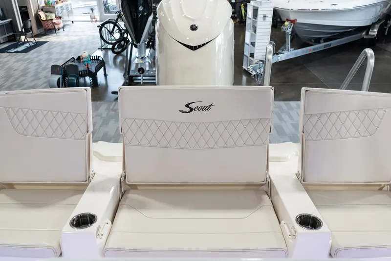 Slide: The Image of 2025 Scout 261 XSS boat seats with cup holders in showroom. - 35