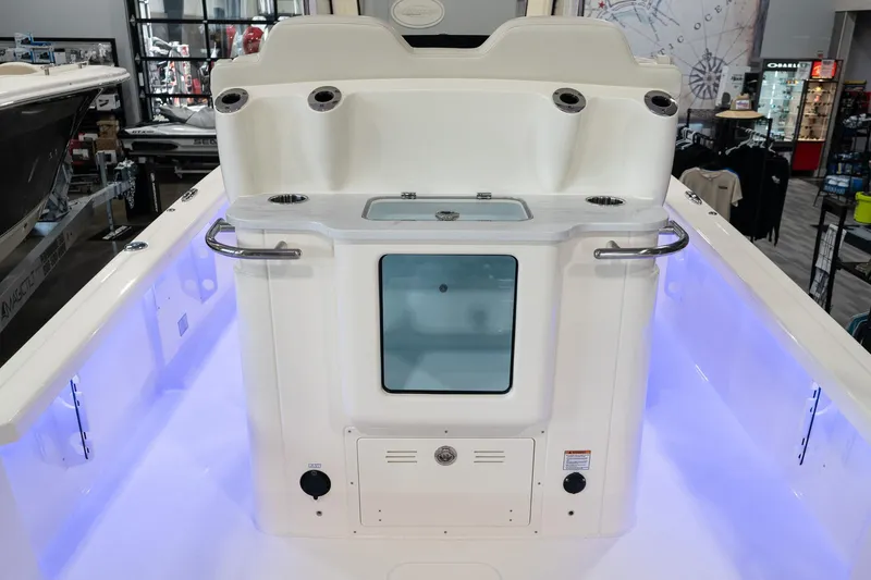 Slide: The Image of 2025 Scout 261 XSS boat interior with illuminated deck and storage compartment. - 43