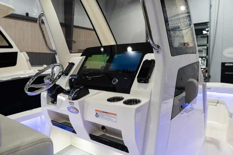 Slide: The Image of 2025 Scout 261 XSS boat dashboard with modern controls and dual screens. - 50