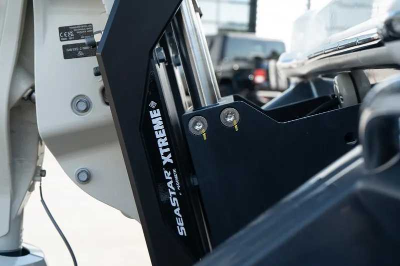 Slide: The Image of Close-up of SeaStar Xtreme hydraulic steering on 2025 Scout 261 XSS boat. - 9