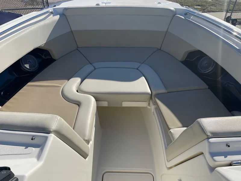 Slide: The Image of 2021 Boston Whaler 240 Vantage boat interior with cushioned seating. - 7