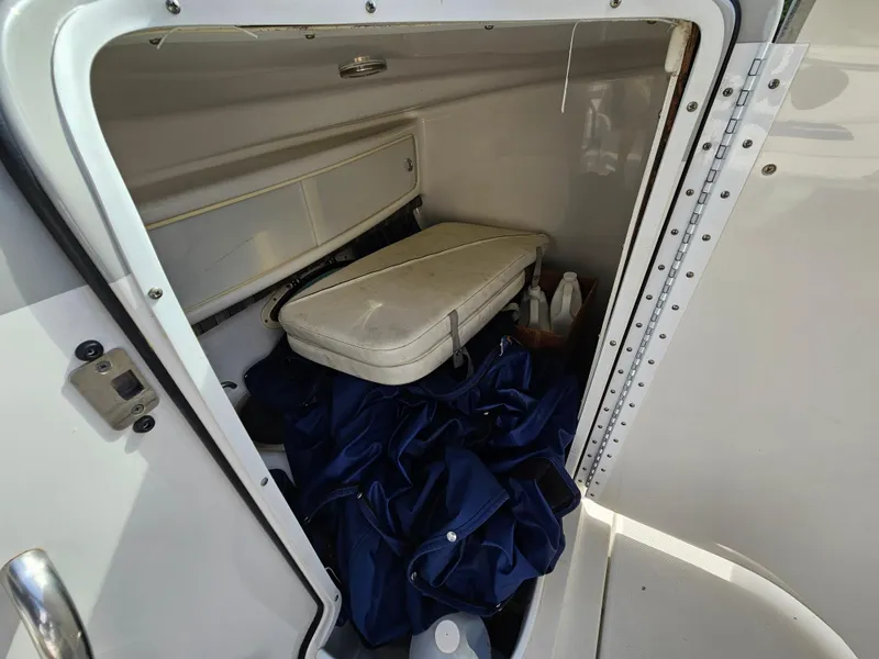 Slide: The Image of Storage compartment of 2007 Formula 280 Bowrider boat with cushions and supplies. - 12