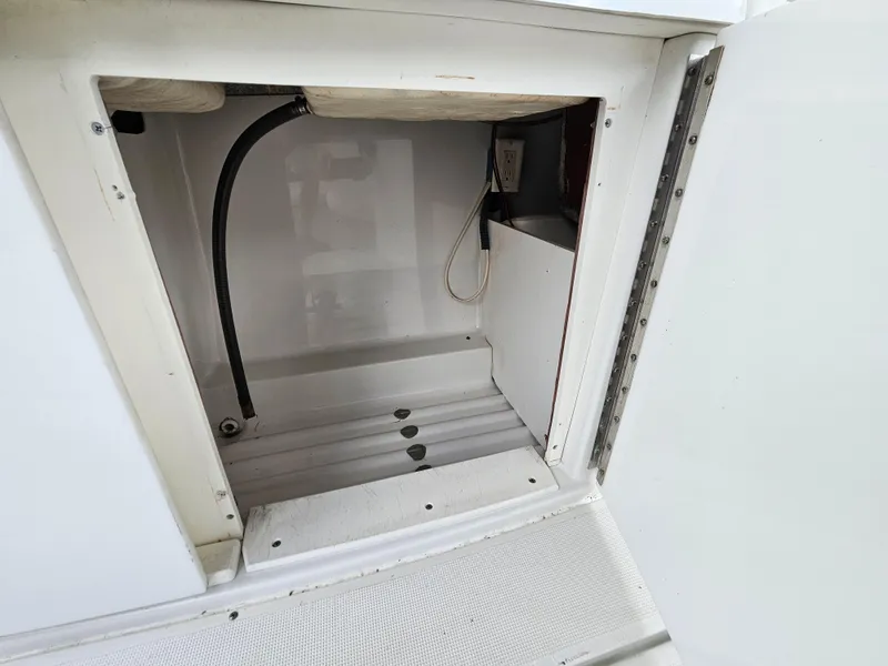 Slide: The Image of Open storage compartment in 2007 Formula 280 Bowrider boat. - 13