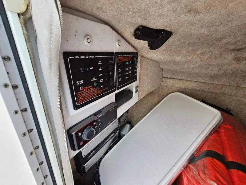 Slide: The Image of 2007 Formula 280 Bowrider control panel with storage compartment and safety equipment. - 14