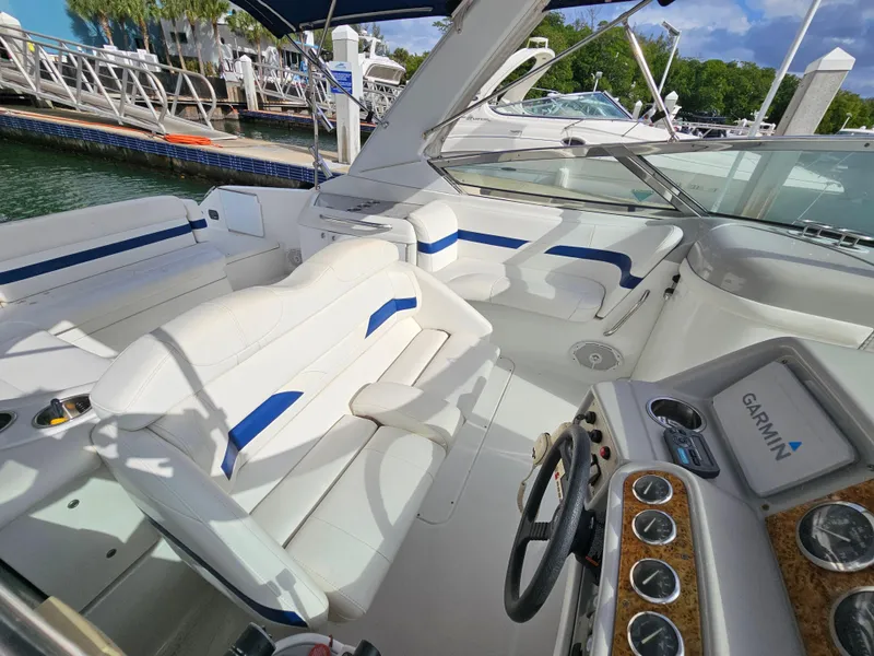 Slide: The Image of 2007 Formula 280 Bowrider boat interior with white seating and Garmin navigation system. - 6