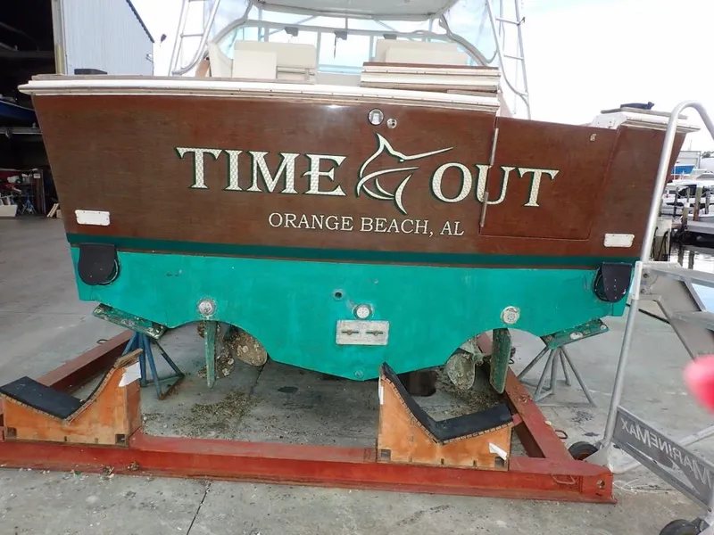 Slide: The Image of 2000 Cabo 35 Express boat named "Time Out" in Orange Beach, AL, on dry dock. - 1